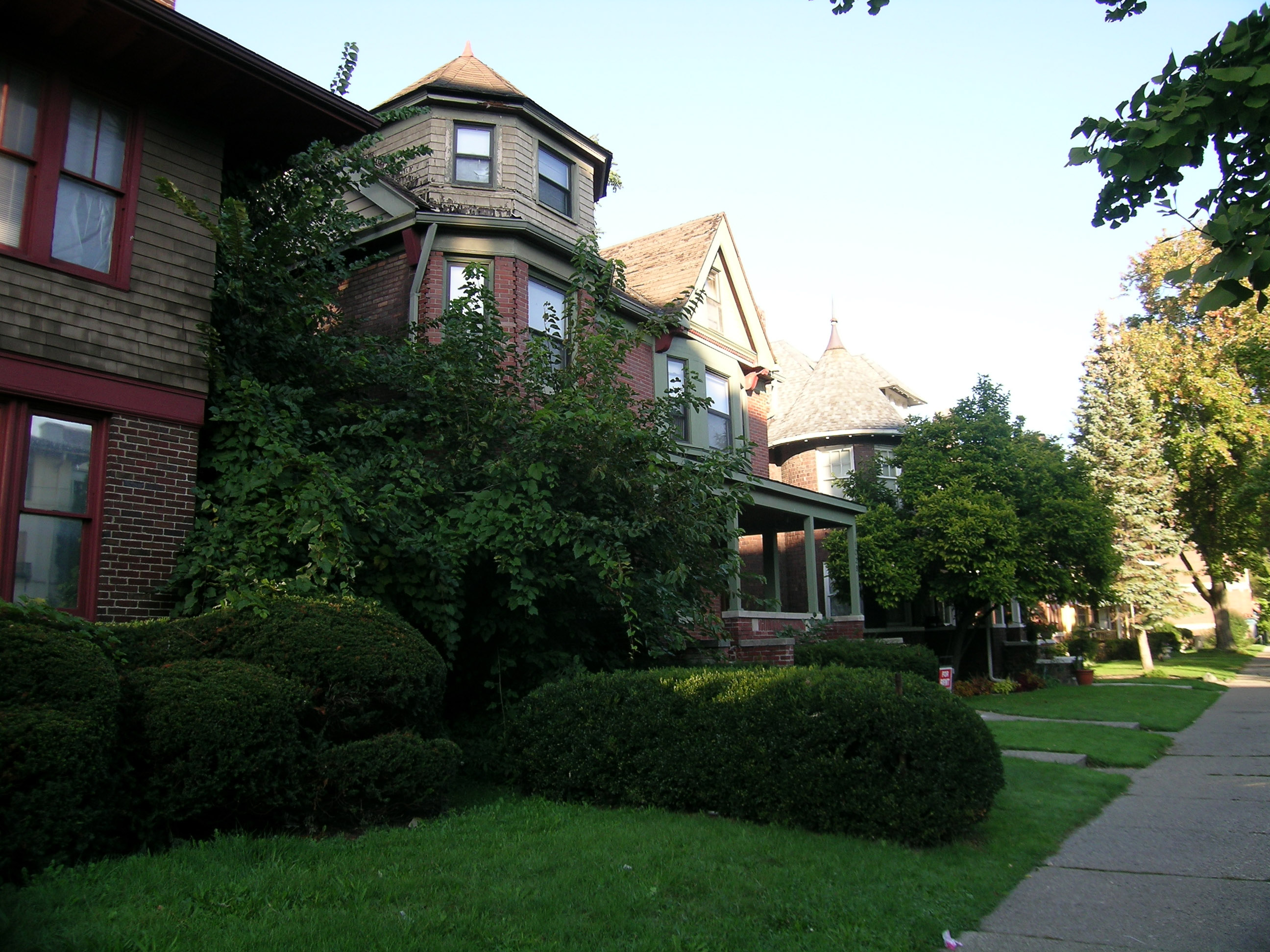 Brick homes and front porches along a residential street in Detroit’s West Village
